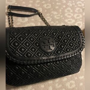 Tory Burch leather black Marion quilted saddle bag.
